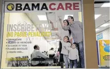  ?? Angel Valentin / New York Times ?? A storefront in Miami promotes the Affordable Care Act. A federal appeals court has struck down a linchpin of the law.