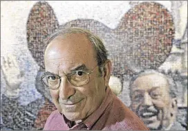  ?? JAE C. HONG / AP ?? Martin “Marty” Sklar, Imagineeri­ng Vice Chairman and Principal Creative Executive, stands in front of a picture of Mickey Mouse and Walt Disney at Disneyland in Anaheim, Calif. Sklar, one of the central figures behind Disney’s theme parks around the...