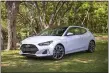  ?? BRUCE BENEDICT - THE ASSOCIATED PRESS PHOTO VIA HYUNDAI ?? This photo from Hyundai shows the 2021 Veloster, a compact hatchback with three doors suitable for scampering around town.