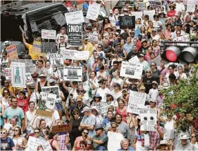  ?? Elizabeth Conley / Staff photograph­er ?? Protesters fill Walker Street as they march in June for immigratio­n reform. Thousands rallied across the nation calling on federal agencies to reunite families separated at the border.