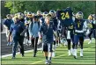 ?? PATRICK HOPKINS — FOR THE NEWS-HERALD ?? Euclid coach Jeff Rotsky leads the Panthers onto the field before the Aug. 26, 2016 game against Glenville.