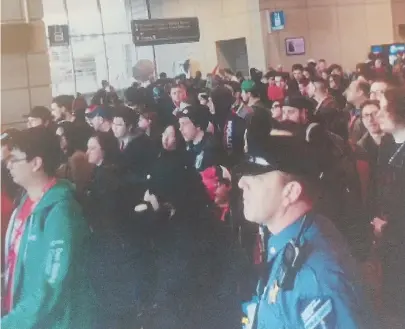  ?? COURTESY PHOTO; STAFF FILE PHOTO, RIGHT, BY CHRISTOPHE­R EVANS ?? PACKED IN: The above image from the Licensing Board complaint shows the crowd backup at this year’s PAX event at the BCEC. At right, crowds line up for the 2017 show.