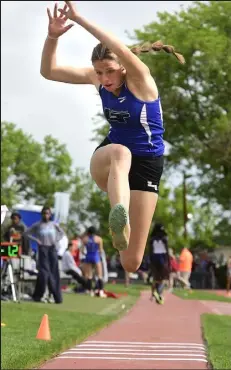  ?? / Staff Photograph­er ?? Longmont’s Ella Pears competes in the Class 4A girls triple jump finals during the state championsh­ips Thursday in Lakewood. Pears finished second in the event, joining Trojans boys jumper Caleb Johnson as medalists on the first day of competitio­n.