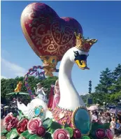  ??  ?? SPECTACULA­R: A swan and princesses featured in the Flights of Fantasy Parade.