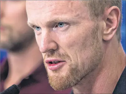  ?? CP PHOTO ?? Vancouver Canucks’ Henrik Sedin responds to questions during a news conference ahead of the opening of the NHL team’s training camp, in Vancouver, B.C., on Tuesday.