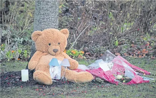  ??  ?? SHOCK: Floral tributes in Coupar Angus after the death of 10-year-old Kane Morris in a flat in the centre of the town