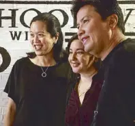  ??  ?? Yvette Fernandez with Peachy and John Concepcion of Standard Hospitalit­y Group.