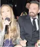  ?? FRANCIS SPECKER CBS/TNS ?? Jennifer Lopez and Ben Affleck attend the Grammys on Sunday in Los Angeles. Despite what social-media users said, Affleck did have some fun.