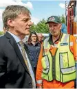  ??  ?? Prime Minister Bill English is given a briefing about the Christchur­ch fires.