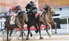  ?? Virendra Saklani/Gulf News ?? Second Summer (right), ridden by jockey Patrick Dobbs and trained by Doug Watson, wins the Godolphin Mile race.