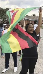  ?? PHOTO: AP ?? A supporter at the Manyame Air Force Base in Harare, waits for the arrival of Emmerson Mnangagwa this week.