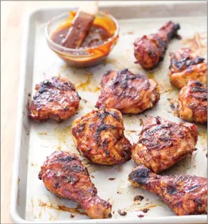  ?? CARL TREMBLAY/AMERICA'S TEST KITCHEN VIA AP ?? This undated photo provided by America's Test Kitchen in May 2018 shows classic barbecued chicken in Brookline, Mass. This recipe appears in the cookbook “Just Add Sauce.”