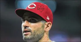  ?? DAVID JABLONSKI / STAFF ?? Reds first baseman Joey Votto honors Dayton with a message on his hat during a game against the Angels on Tuesday at Great American Ball Park in Cincinnati.