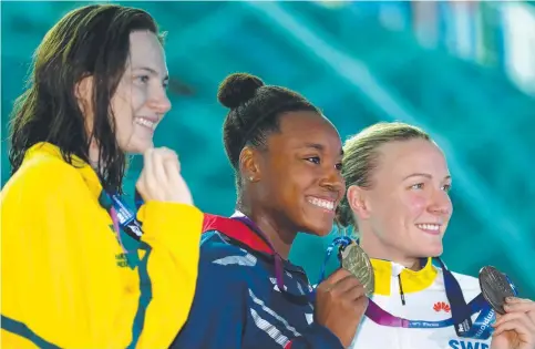  ?? Picture: GETTY IMAGES ?? Australian silver medallist Cate Campbell, American Simone Manuel ( gold) and Sweden’s Sarah Sjostrom (bronze) during the medal ceremony for the women's 100m freestyle final