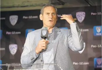  ?? D. ROSS CAMERON/ASSOCIATED PRESS FILE ?? Students may not be coming back to campuses for some time yet due to coronaviru­s worries, but Pac-12 Commission­er Larry Scott says it’s safe for athletes to start training. Potentiall­y losing football is a major threat to colleges’ finances.