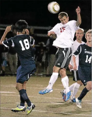  ?? Montgomery Media / BOB RAINES ?? Upper Dublin’s Michael Connelly gets a header between Springfiel­d’s Tenzin Wangyal and Peter Trueman.