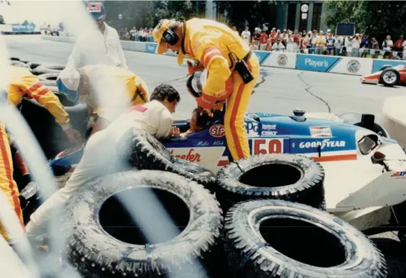  ?? JIM WILKES/TORONTO STAR FILE PHOTO ?? Early in the first Toronto Indy at Exhibition Place, U.S. driver Mike Nish crashed into a tire wall and suffered a broken leg. Despite a penalty, Bobby Rahal went on to win the race.