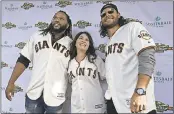  ?? JOSE CARLOS FAJARDO – STAFF PHOTOGRAPH­ER ?? Yvonne Calleri, of Auburn, middle, poses for a photograph with the Giants’ Johnny Cueto, left, and Brandon Crawford during the team’s FanFest at AT&T Park Saturday.