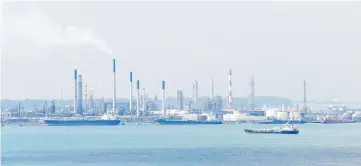  ??  ?? A general view shows the Shell petroleum refinery on Bukom island in Singapore. — AFP photo