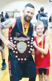  ??  ?? The now and the next, coach Mike Santo shows off the CBL shield in Korumburra with Ollie Muir, who could be a future Warrior in waiting.