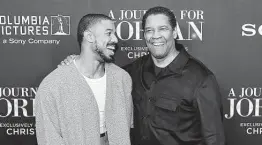  ?? Theo Wargo / Getty Images for Sony Pictures ?? Michael B. Jordan, who portrays a dad killed in combat, joins director Denzel Washington at the world premiere of “A Journal For Jordan” in New York City.