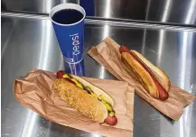  ?? ANGELINE WOO/LOS ANGELES TIMES/TNS ?? Two hot dog combos at the indoor food court at the Costco location in Van Nuys, Los Angeles.