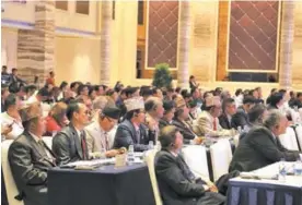  ?? PALDEN NYIMA / CHINA DAILY ?? Delegates from home and abroad share insights at a forum during the expo.
