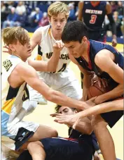  ?? RECORDER PHOTO BY CHIEKO HARA ?? Monache High School's Cooper Martin, left, and Nash Wobrock battle for the loose ball Wednesday during the fourth quarter against Tulare Western High School at Monache.