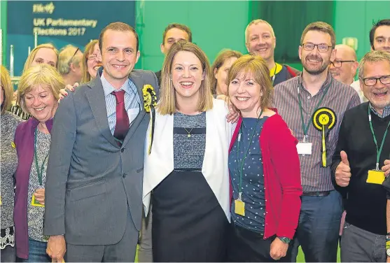  ?? Picture: Steven Brown. ?? Smiles all round following the count at the Michael Woods Centre in Glenrothes as Stephen Gethins, left, retained the North East Fife seat for the SNP with a two-vote margin over Elizabeth Riches of the Liberal Democrats.
