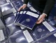  ?? THE ASSOCIATED PRESS ?? Copies of President Donald Trump’s fiscal 2018 federal budget are seen on Capitol Hill in Washington.