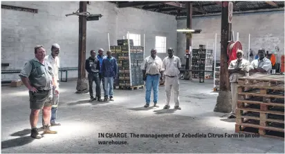  ??  ?? IN CHARGE. The management of Zebediela Citrus Farm in an old warehouse.
