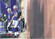  ?? AFP ?? New England quarterbac­ks Jarrett Stidham, left, and Tom Brady before a game last season.