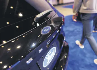  ?? ?? A logo on a 2024 Ford Escape at the Canadian Internatio­nal Auto Show in Toronto, Ontario, Canada, Feb. 15, 2024.