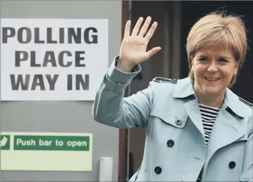  ??  ?? Scotland’s First Minister and SNP leader Nicola Sturgeon arrives at her local polling station in Glasgow to cast her vote for the local council elections.