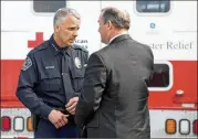  ?? PHOTOS BY JAY JANNER / AMERICAN-STATESMAN ?? Interim Austin Police Chief Brian Manley (left) talks to FBI special agent In charge Christophe­r Combs on Monday. “We don’t know why the bomber is doing this,” Combs said.