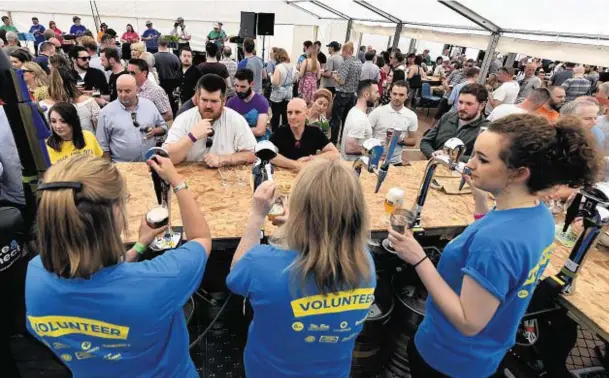  ?? Photograph­s: Kenny Elrick ?? THIRSTY WORK: Bar staff were kept busy in the marquee at Stonehaven’s Midsummer Beer Happening in Baird Park.