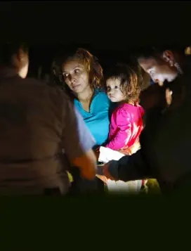  ??  ?? A Honduran asylum seeker at the US-Mexico border with her two-yearold daughter, who watches on as her mother is searched and detained.