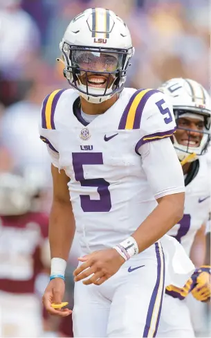  ?? JONATHAN BACHMAN/GETTY ?? LSU quarterbac­k Jayden Daniels passed for 3,812 yards and 40 touchdowns and ran for 1,134 yards and 10 scores.