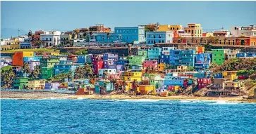  ??  ?? You might not be able to recreate Puerto Rico’s colourful houses in your living room, but we can still salsa.