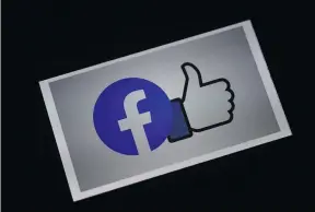  ?? AFP PHOTO ?? In this file illustrati­on photo taken on March 25, 2020, a Facebook App logo is displayed on a smartphone in Arlington, Virginia.