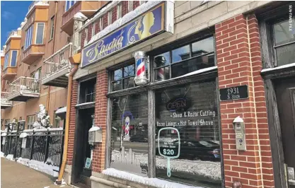  ?? ?? The South Loop barbershop where a gun that was trafficked to Chicago by soldiers was used in a killing, according to federal authoritie­s.