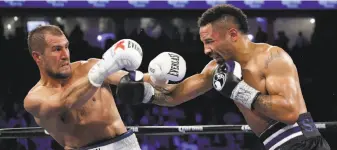  ?? Associated Press 2016 ?? Kovalev backs away from a punch from Ward during their November 2016 fight.