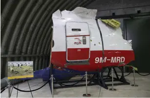  ?? (Michael Kooren/Reuters) ?? WRECKAGE OF the MH17 airplane is seen yesterday after the presentati­on in the Netherland­s of the final report into the crash of the Malaysia Airlines flight over Ukraine.