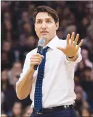  ?? CP PHOTO NATHAN DENETTE ?? Prime Minister Justin Trudeau answers questions from the public during his town hall meeting in Hamilton, Ont., on Wednesday.