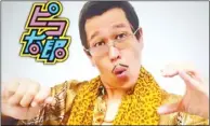  ??  ?? 日本網路紅人PIKO­太郎以自創曲「PPAP」，紅遍日本大街小巷。 （取材自推特）