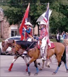  ?? MARK HUMPHREY ENTERPRISE-LEADER ?? Fancy-dressed cowgirls carry the United States of America and Arkansas State flags while leading the Lincoln Rodeo parade. Rodeo events begin on Wednesday with the Little Mister and Little Miss contest at 7 p.m. followed by a street dance at the...