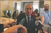  ?? The Associated Press ?? BLOOMBERG: Former New York City Mayor Michael Bloomberg talks to the media after filing paperwork to appear on the ballot in Arkansas' March 3 presidenti­al primary, Tuesday in Little Rock.