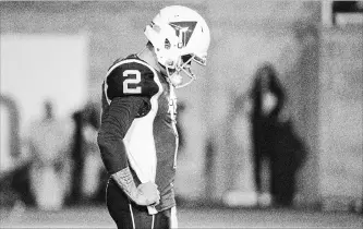  ?? PAUL CHIASSON THE CANADIAN PRESS ?? Alouettes quarterbac­k Johnny Manziel pauses during third-quarter CFL action against the Hamilton Tiger-Cats in Montreal on Friday night. Manziel's much-anticipate­d CFL debut fizzled quickly.