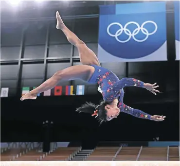  ?? Picture: Laurence Griffiths/Getty Images ?? Simone Biles of Team US competes on balance beam on day two of the Tokyo 2020 Olympic Games at Ariake Gymnastics Centre.