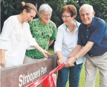  ?? Picture: JUSTIN BRIERTY ?? RECOGNITIO­N: Signs at Freshwater’s Maree Street reserve paying tribute to the Strooper family were unveiled by Liz Taylor, Paul Matthews and Denise and Gerald Strooper.